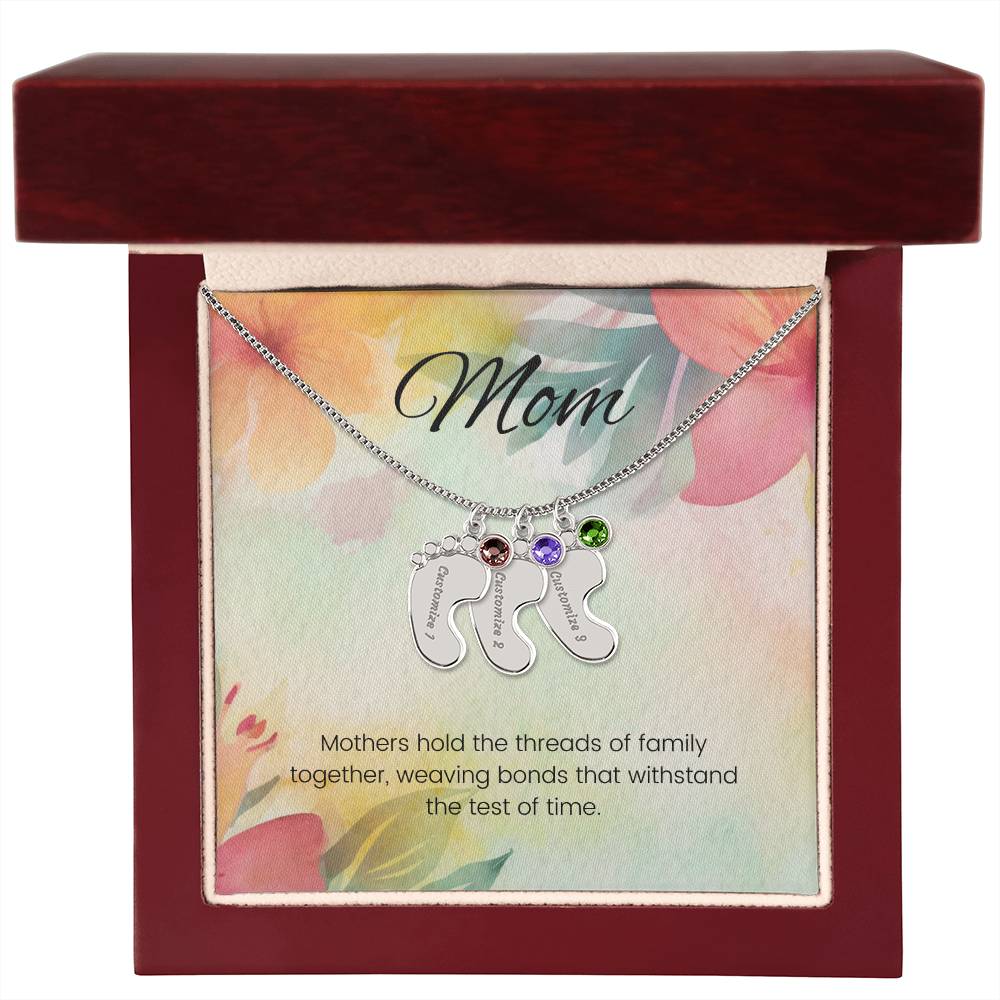 Mothers hold the threads of family together...Engraved Baby Feet Necklace with Birthstone